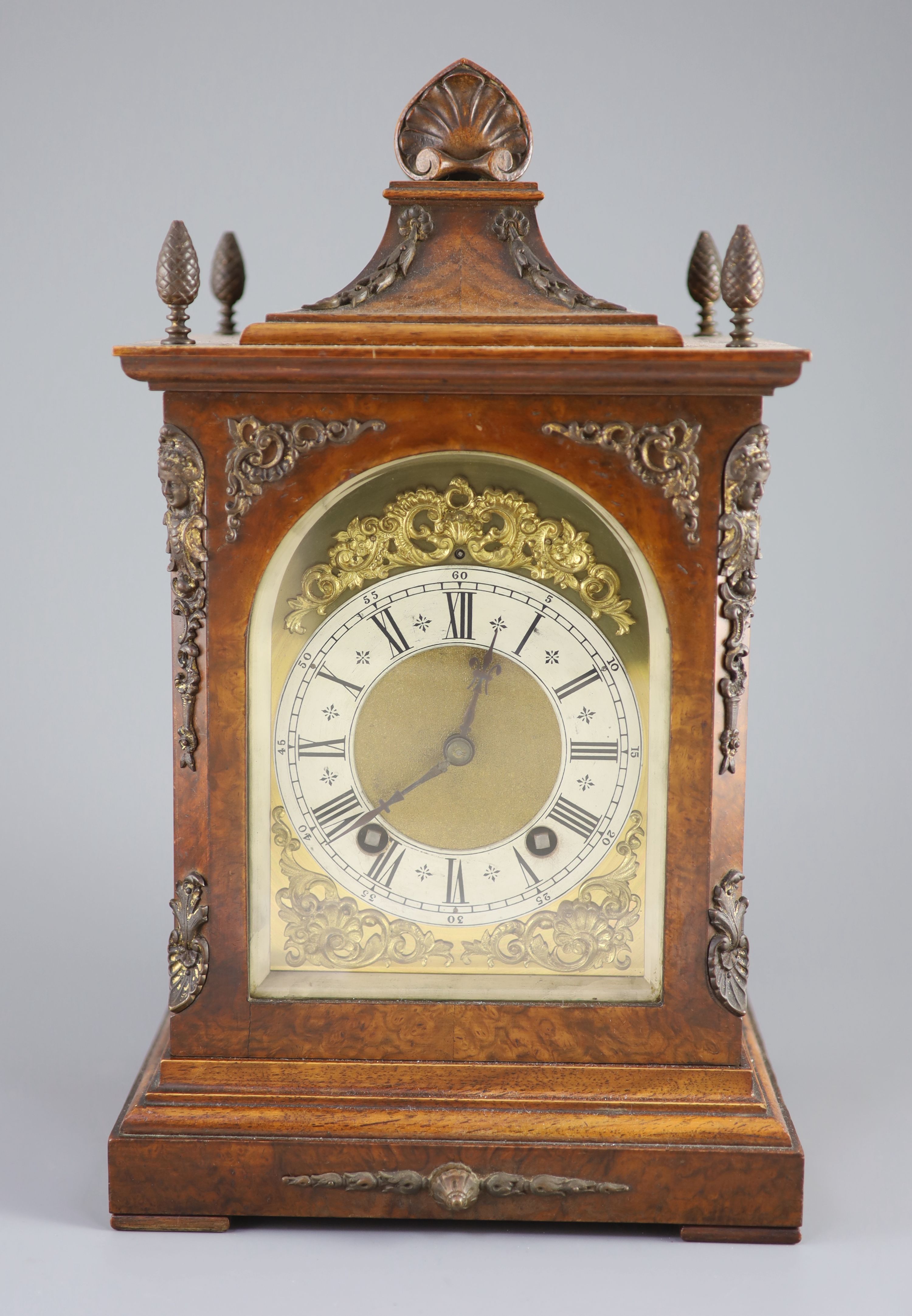 A late 19th century walnut cased bracket clock, 38cm high